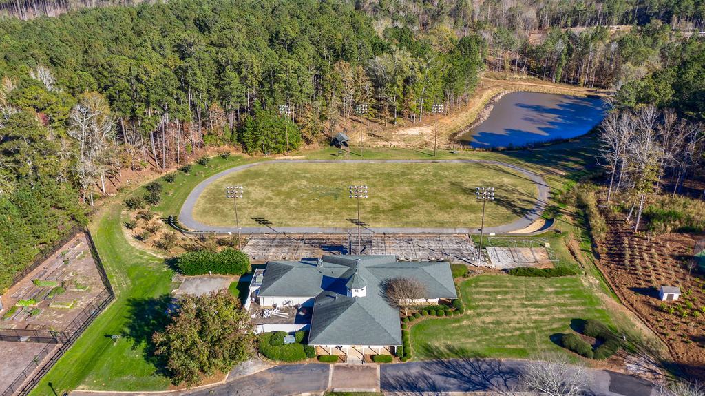 the grove which includes a community garden, walking trails, track, dog park and pickle ball courts