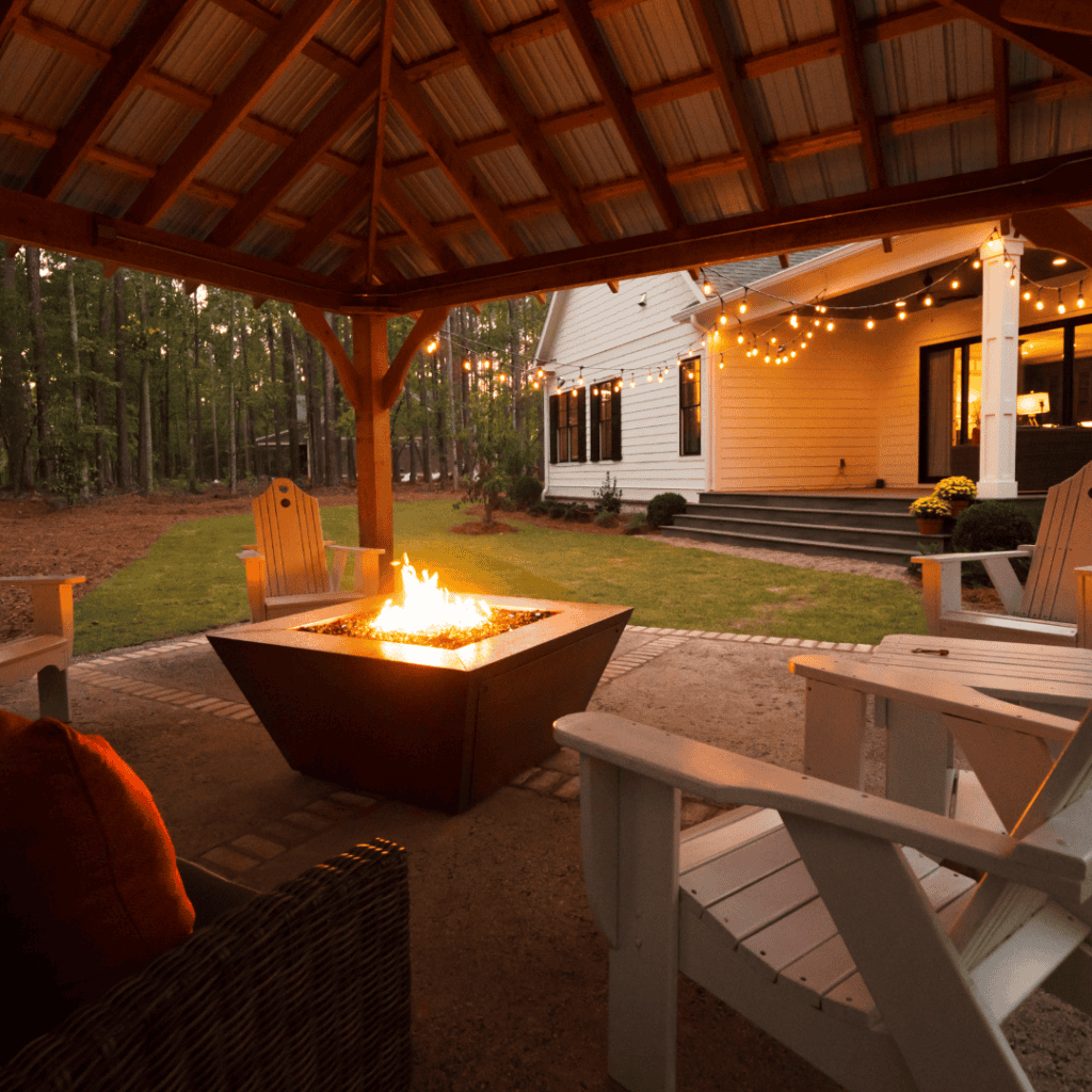 Southern backyard porch with fire pit for entertaining at Harbor Club on Lake Oconee